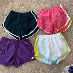 4 pairs of Nike and adidas running shorts